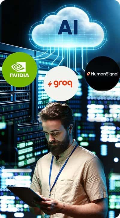 Man using tablet with AI cloud, NVIDIA, Groq, HumanSignal logos in data center.